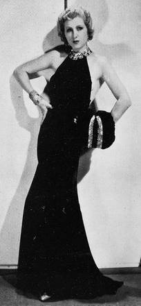 Jeanne Helbling in einem von René Hubert entworfenen Abendkleid im Film Avec l'assurance.